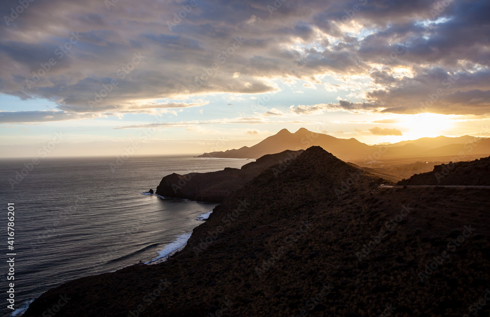 Coastal landscape in golden sunset in Cabo de Gata National Park Almeria Spain