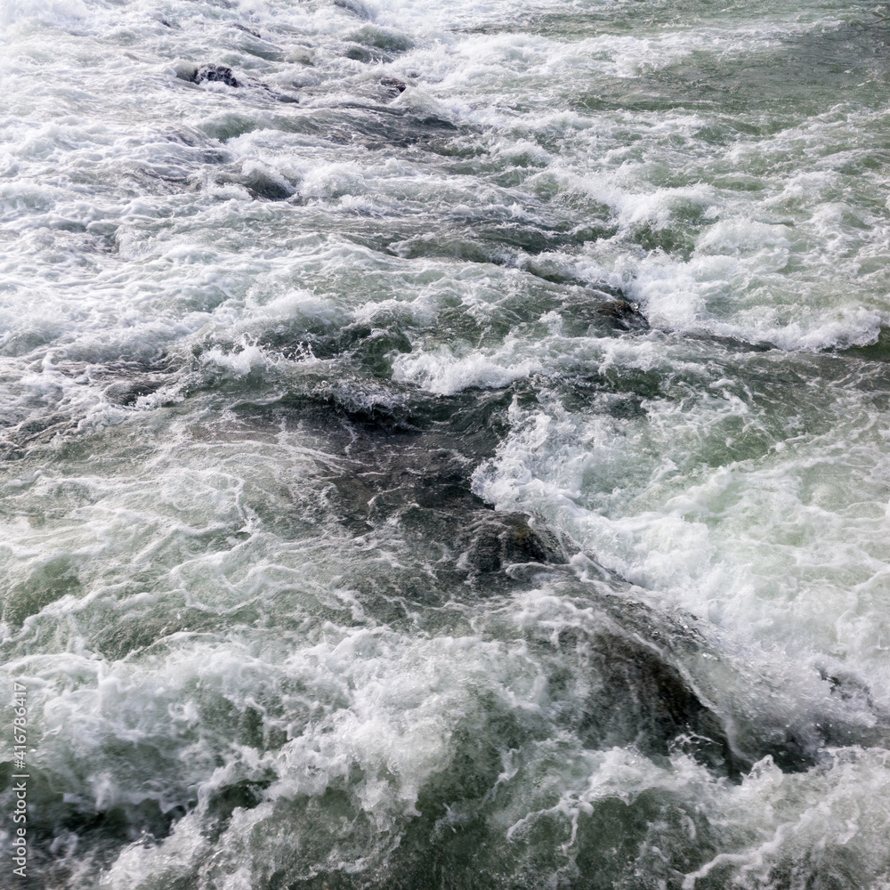 Fototapeta premium The sparkling turbulent water of the river Vrbas, rapid water movement, power of nature