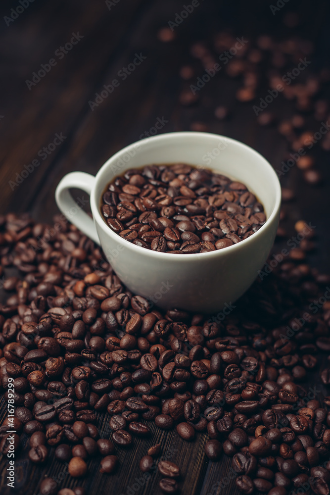 cup with coffee grains on a wooden table aromatic drink Arabica product cup with coffee grains on a wooden table aromatic drink Arabica product