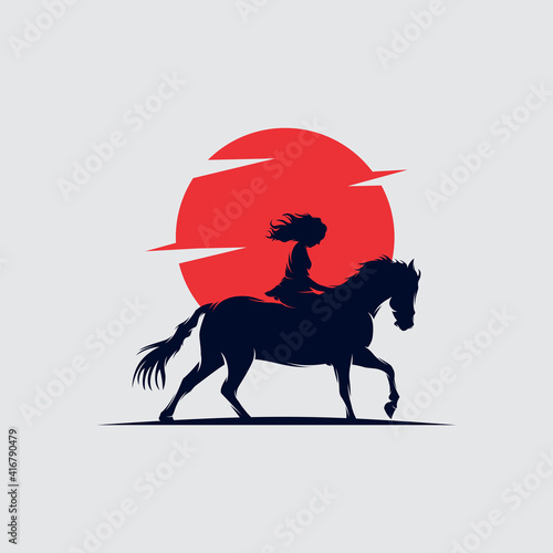 cowgirl riding a horse and throwing lasso in the sunset logo