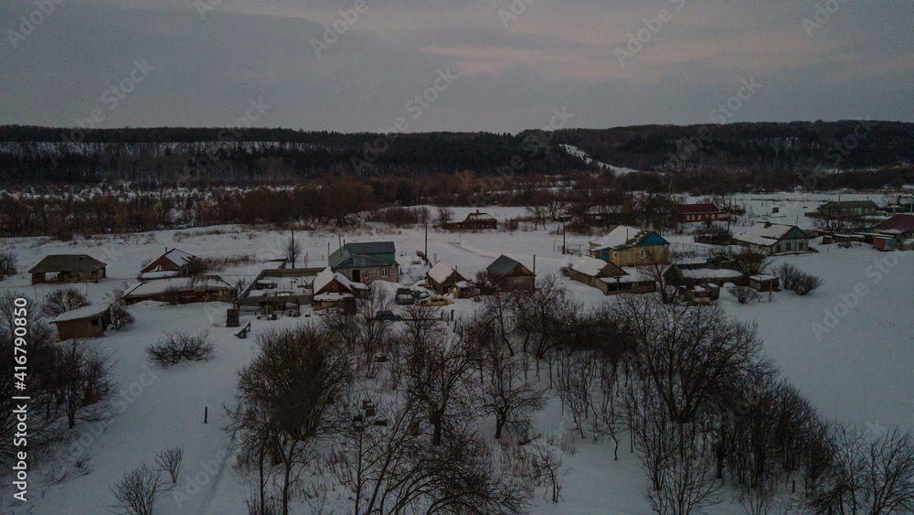 sunset over a winter Russian village in the Penza region