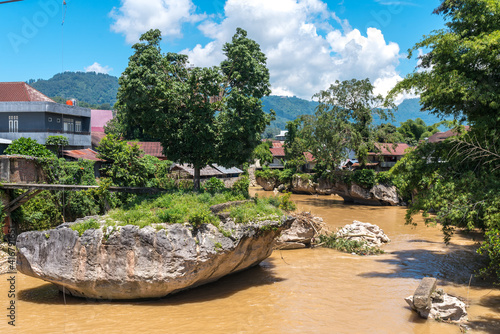 Rocks and isles in the Sadan River in the town Rantepao. With about 180 kilometers, it is the longest and one of the major rivers river in the province South Sulawesi photo