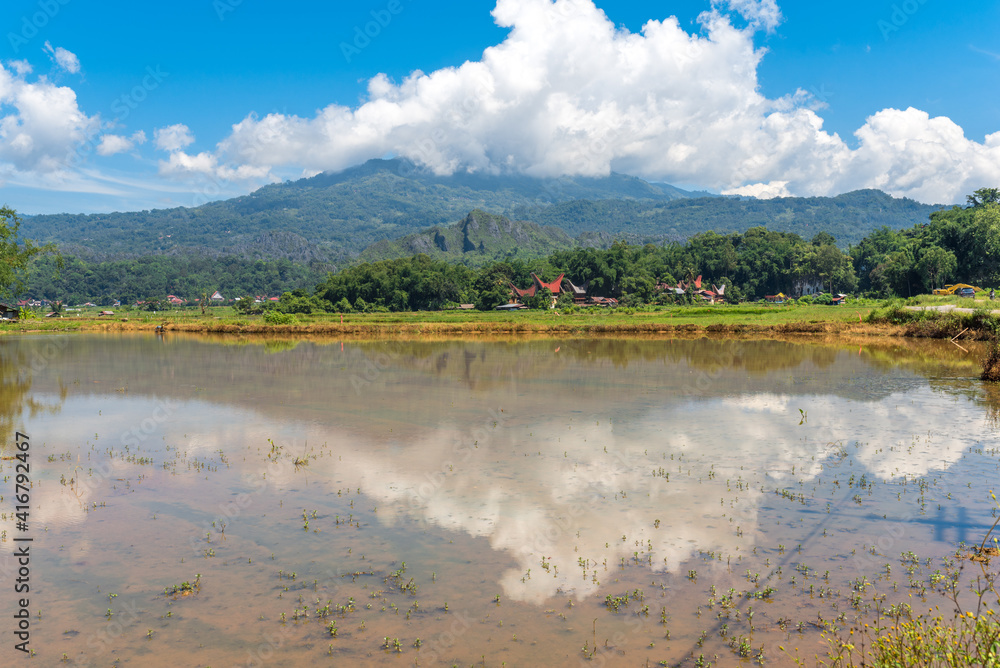 Landscape in Tana Toraja. The Torajan economy is based on agriculture, with cultivated wet rice in terraced fields on mountain slopes and in valleys and fish breeding