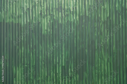 green painted sheet metal wall in the street (ID: 416793234)