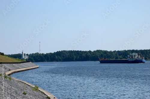 cargo ship on the river Volga in summer time