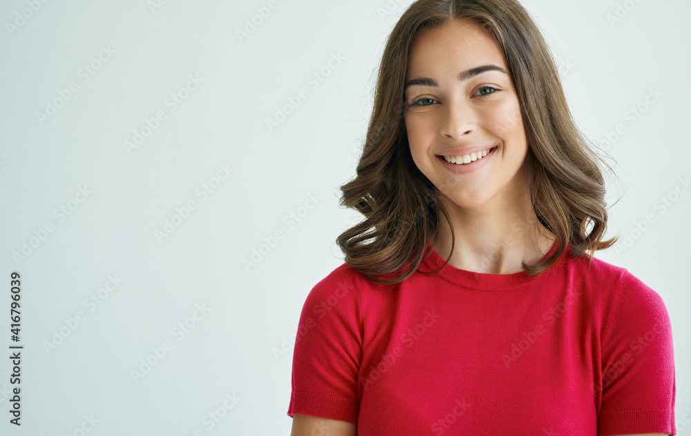 Pretty woman in red t-shirt lifestyle emotions gray background Pretty woman in red t-shirt lifestyle emotions gray background