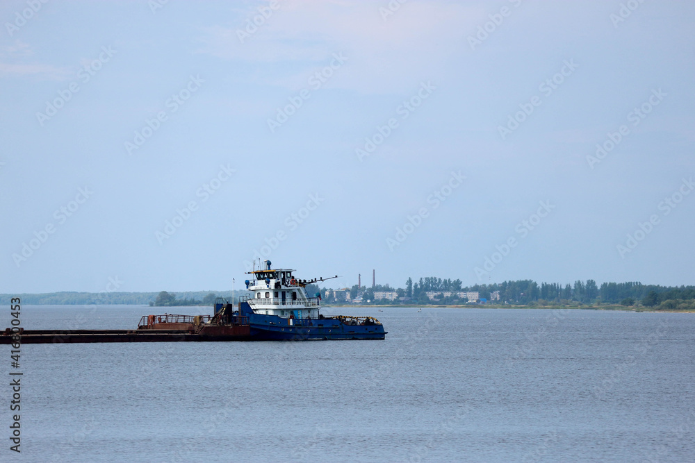 tug and barge on the Volga river in Russia summer view

