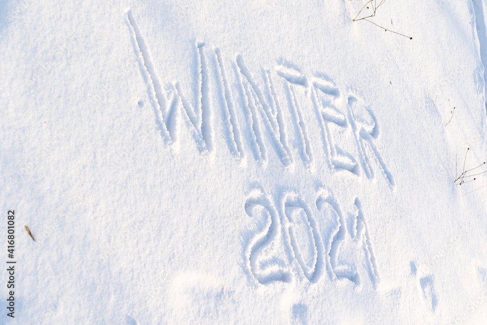 inscription on pure white snow on a frosty winter sunny day. close-up. russia inscription on pure white snow on a frosty winter sunny day. close-up. russia