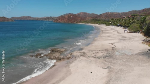 Aerial views of waves crashing at Penca beach in Guanacaste, Costa Rica