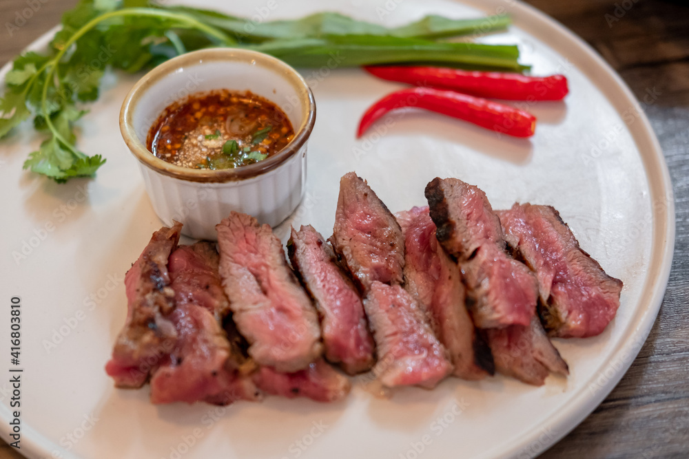 Medium rare meat on plate with sauce Medium rare meat on plate with sauce