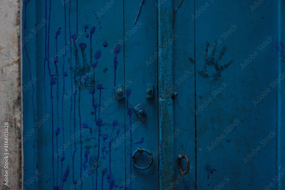 handprint on blue wall 