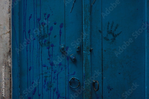 handprint on blue wall 