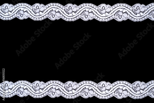 Lace trim ribbon over black background