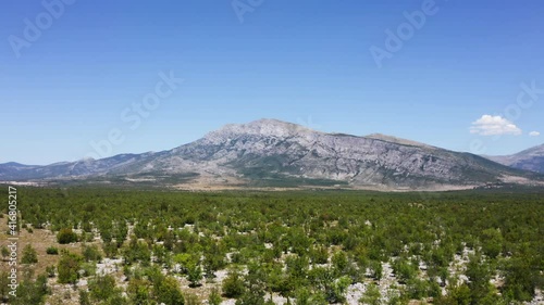 Sinjal or Dinara (1831 m) mountain - the highest point of Croatia in the Dinaric Alps on the border between the Republic of Croatia and Bosnia and Herzegovina. Aerial drone flying up 4K footage. photo