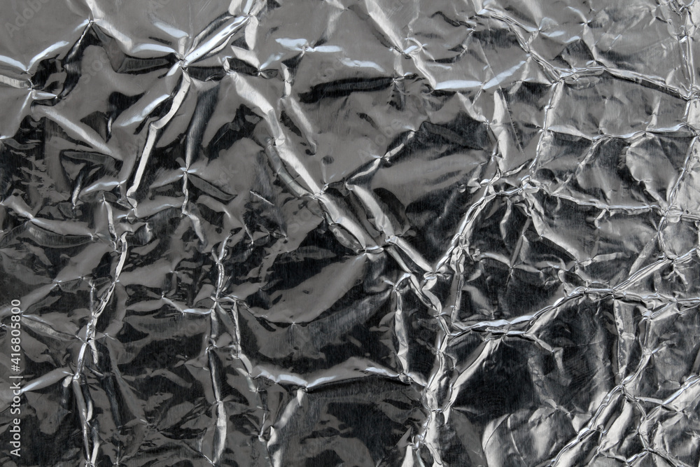 Crumpled foil texture and blank space Crumpled foil texture and blank space