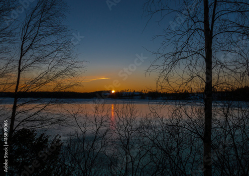 Sunset at the frozen lake Älgsjön in Värmland / Sweden. © Margit Kluthke