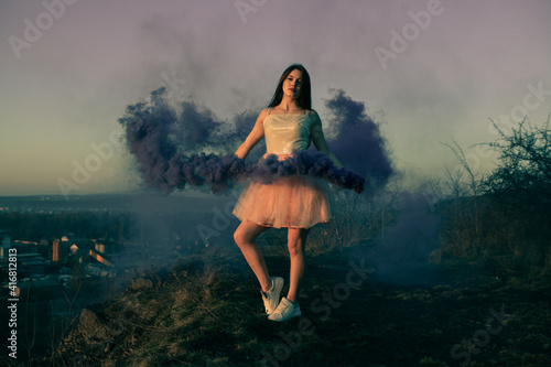 Beauty girl colored smoke