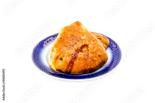 National dish samsa in a plate on a white background.