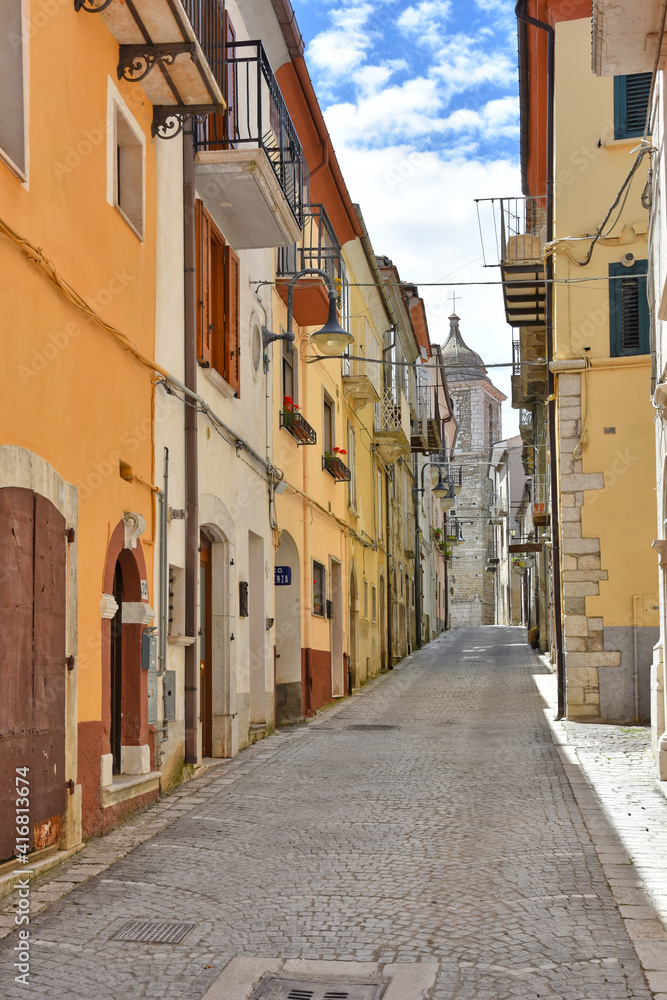 A street among the colorful houses of Frosolone, an old town in the Molise region, Italy.