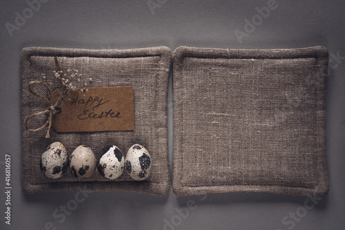 Easter quail eggs on a natural linen napkin background. Zero Waste pattern. Flat lay, close-up, copy space. photo