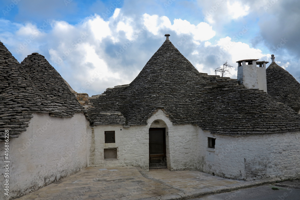 road with white trulli in Alberobello road with white trulli in Alberobello