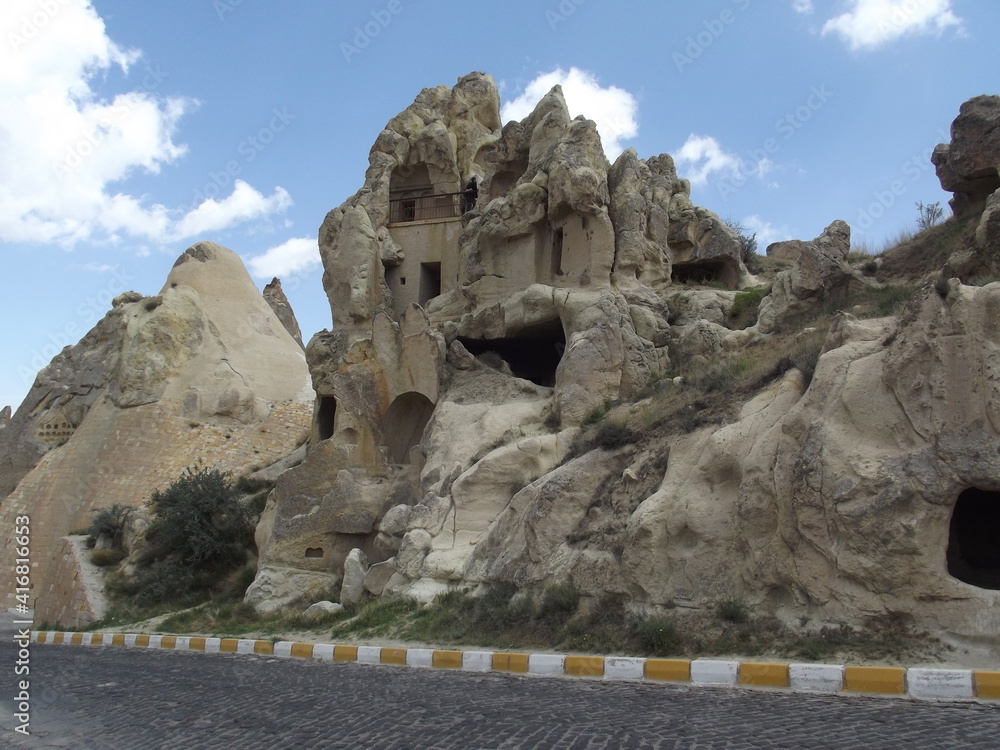 Cappadocia, Turkey close to the old house on a cliff. The old cave houses were carved in ston