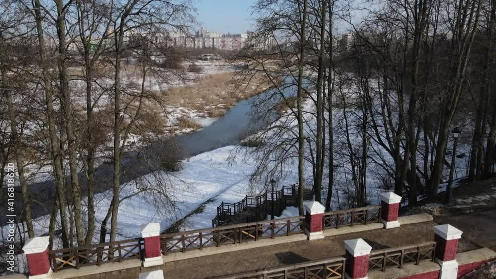 Architecture in Loshitsa Park, Minsk, Belarus. Flying over the arch. Camera back. Winter landscape. Architecture in Loshitsa Park, Minsk, Belarus. Flying over the arch. Camera back. Winter landscape.