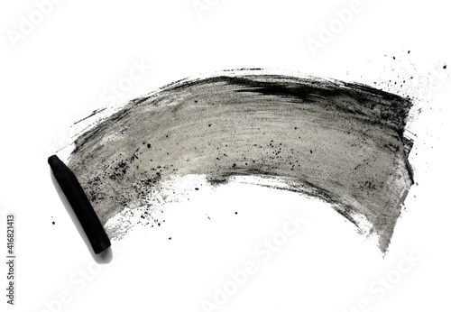 Black compressed charcoal sticks for drawing. Abstract black shapeless spot and charcoal sticks on a white background. Texture with chaotic smudges. photo