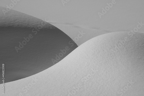 Obraz na plátně mounds of fresh snow black and white contrast light and dark shadow shapes and c