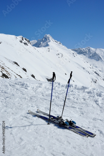 A pair of skis, ski poles and Giewont in Tatra mountains in Poland.