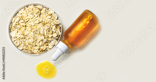 Oat Avena Sativa Kernel Oil with pipette in the white background