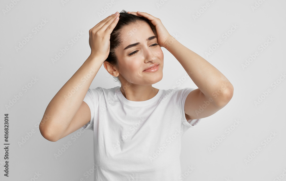 woman holding face headache and migraine health problems woman holding face headache and migraine health problems