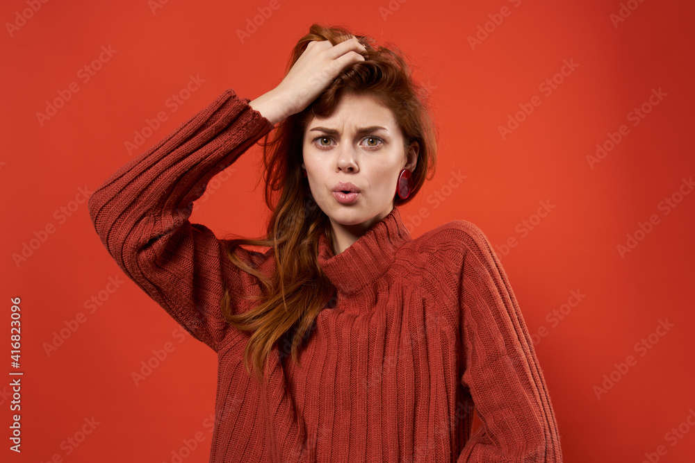 pretty woman in red sweater decoration fashion hairstyle glamor red background pretty woman in red sweater decoration fashion hairstyle glamor red background