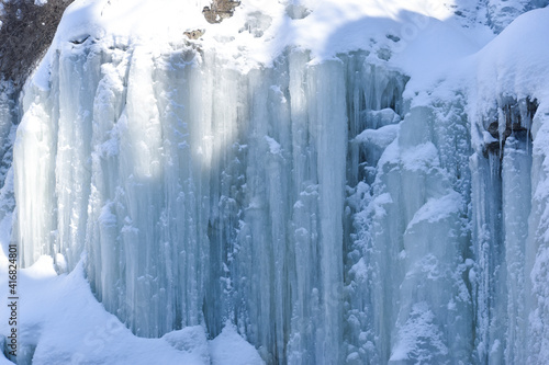 Large icicles around a waterfall