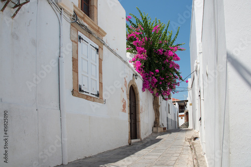 Beautiful empty street at Lindos, Rhodes, Dodecanese, Greece on a sunny day