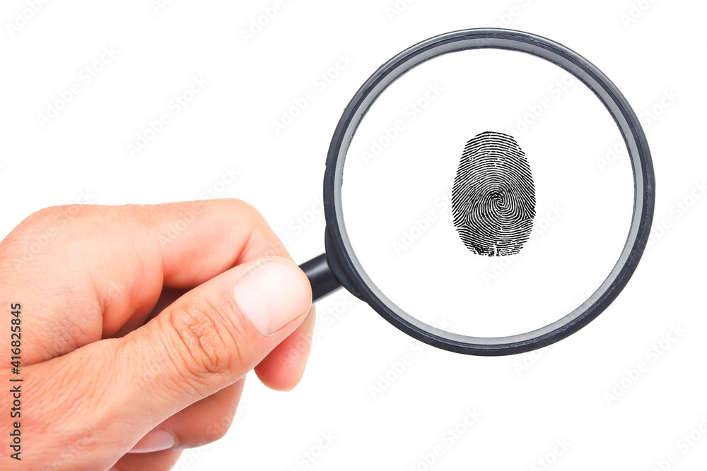 Magnifying glass in hand and fingerprint isolated on white background Magnifying glass in hand and fingerprint isolated on white background