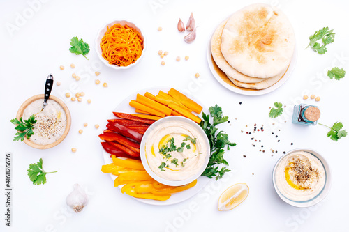 Wallpaper Mural Various bowls of homemade hummus, Baba ghanoush and Korean carrot. Traditional hummus with thyme, olive oil and paprika, vegetables, sweet pepper  and pita. Middle Eastern authentic Arabic cuisine. Torontodigital.ca