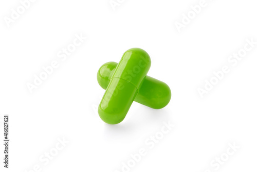 green capsules isolated on white background