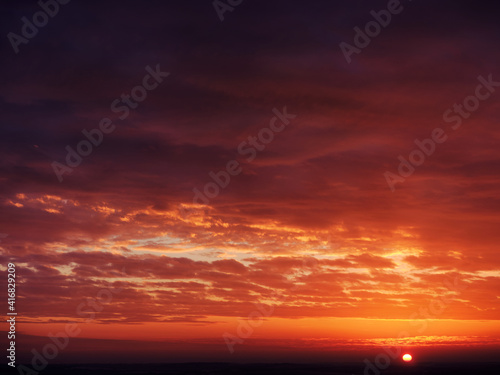 Dramatic sunset sky - with sun © olegkruglyak3