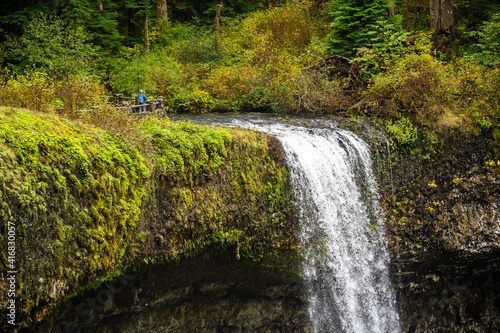 A man at South Falls overlook in Silver Falls Satate Park near Silverton Oregon photo