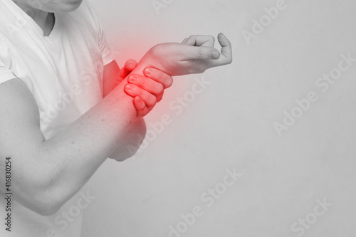 Person man experiencing pain in a hand part