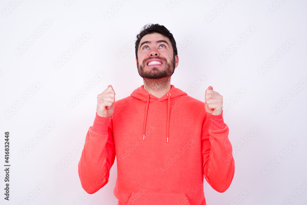 Young champion having success being glad to achieve his goals. Victory and triumph concept. Young champion having success being glad to achieve his goals. Victory and triumph concept.