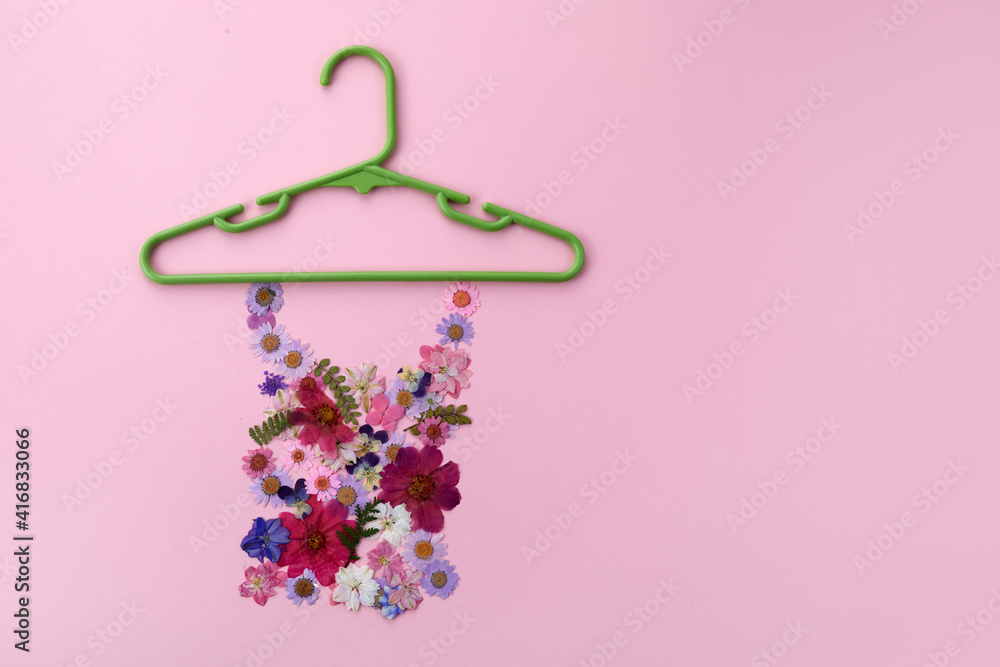 Spring sale concept with colorful flowers on pink background. Flat lay, top view. Spring sale concept with colorful flowers on pink background. Flat lay, top view.