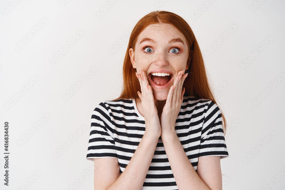 Close up portrait of surprised happy freckled redhead girl Close up portrait of surprised happy freckled redhead girl