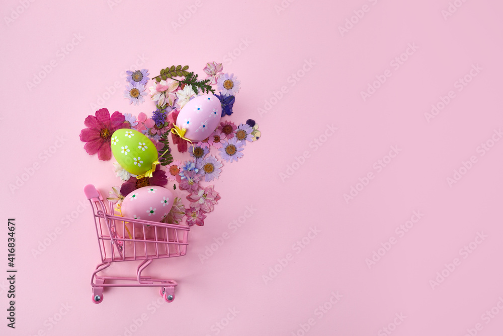 Happy Easter big hunt or sale banner with Colorful Eggs in shopping cart on pink background.