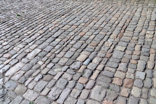 Cobblestone background, stone paved street