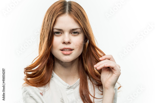 pretty elegant woman red hair glamor cosmetics light background