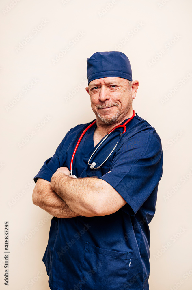 Studio portrait of a veteran doctor in an operating room suit Studio portrait of a veteran doctor in an operating room suit