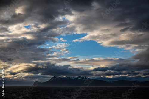 Chile, Patagonia. Dark clouds breaking in Strait of Magellan. photo