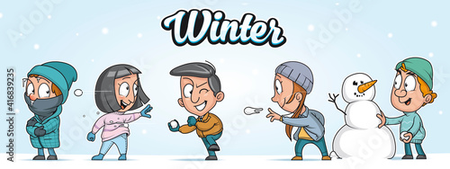 Group of people playing in the snow  in a winter day